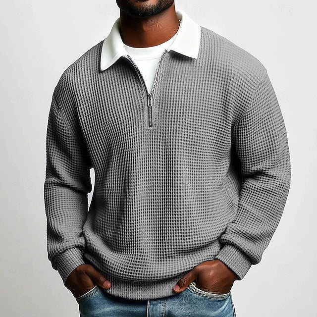 Polo homme à manches longues, col zippé, en tissu gaufré uni, idéal pour le printemps et l'automne. Parfait pour le quotidien.